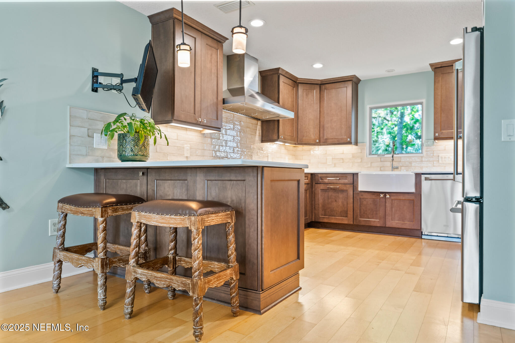 1836 Nightfall Drive Neptune Beach, FL 32266 - Photo 6 of 56 a kitchen with kitchen island granite countertop wooden cabinets and counter space