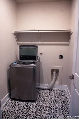 a close view of a sink a microwave and a rug