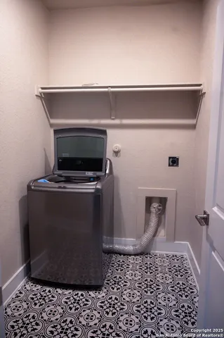 a close view of a sink a microwave and a rug