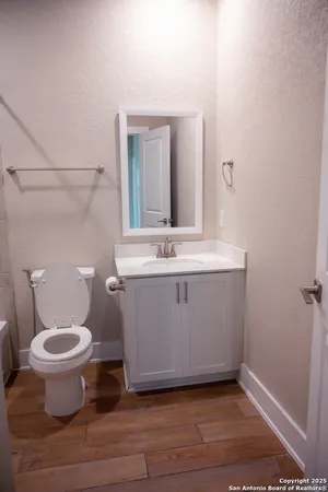 a view of bathroom with a sink and a mirror