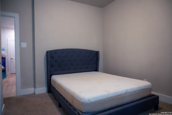 a bedroom with a bed and a cabinets