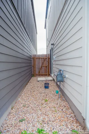 a view of a backyard with sitting area