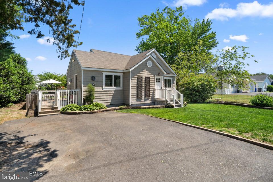 10 Mandalay Road Brick, NJ 08723 - Photo 2 of 40 Charming home with lush greenery.