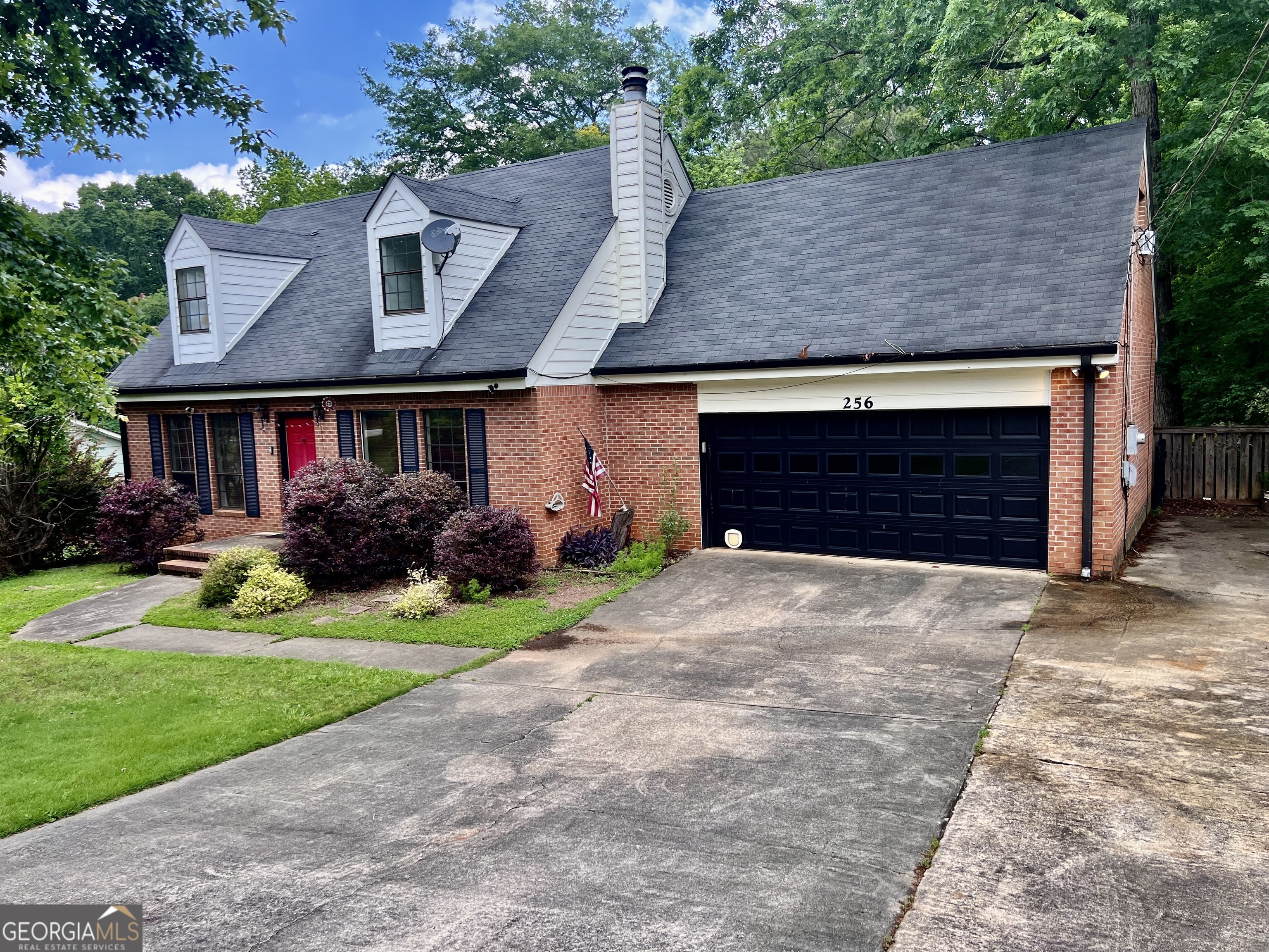 256 Cherokee Ridge Athens, GA 30606 - Photo 1 of 35 a front view of a house with a yard and garage