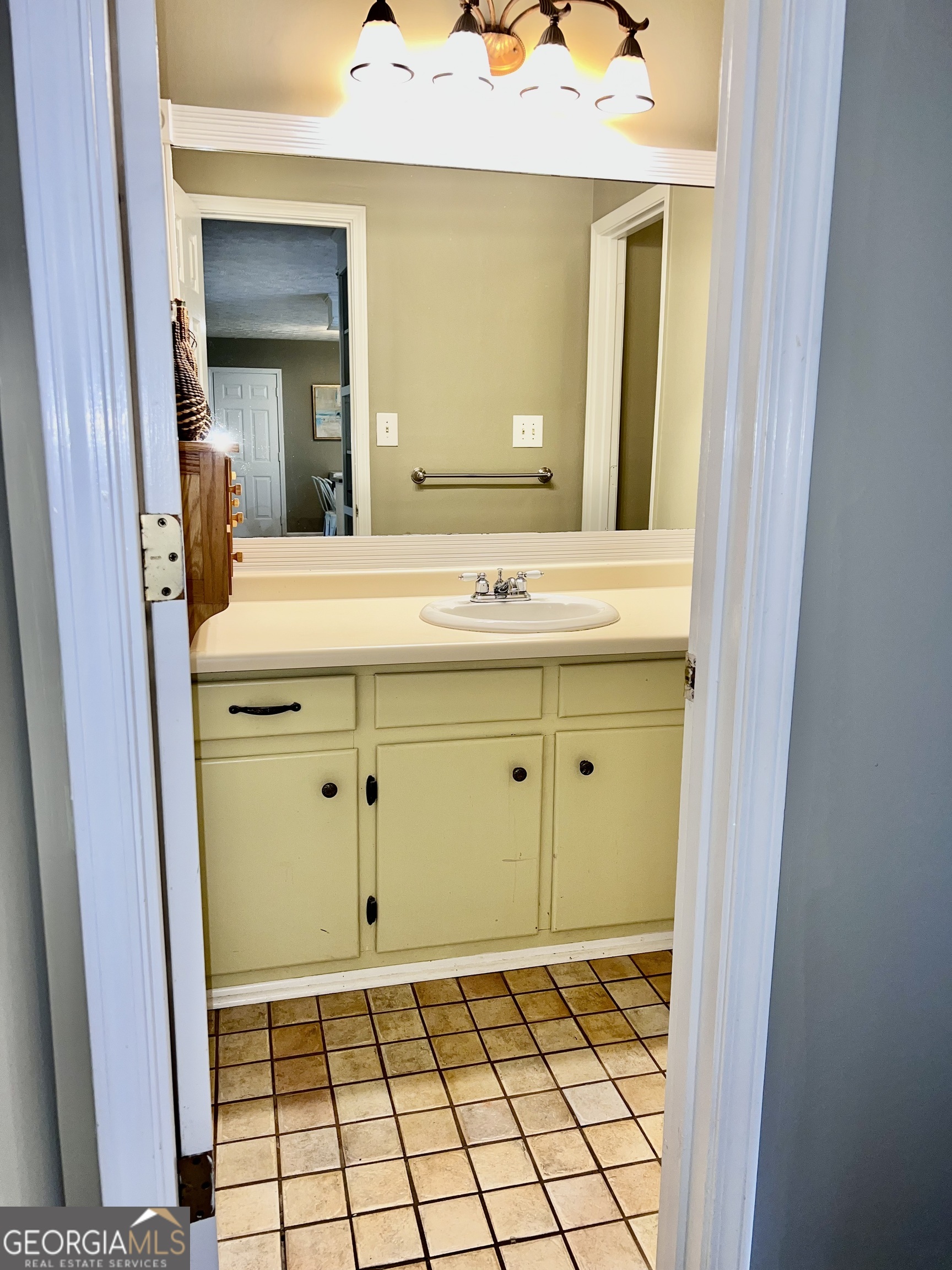 256 Cherokee Ridge Athens, GA 30606 - Photo 11 of 35 a bathroom with a sink a vanity and a mirror