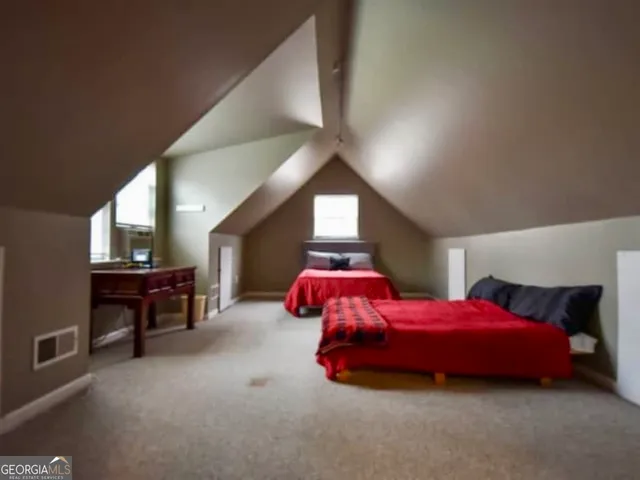 a kids room with a bed and a window