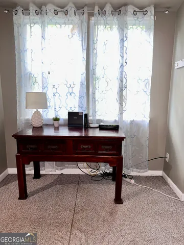 a view of a workspace with a window and a table