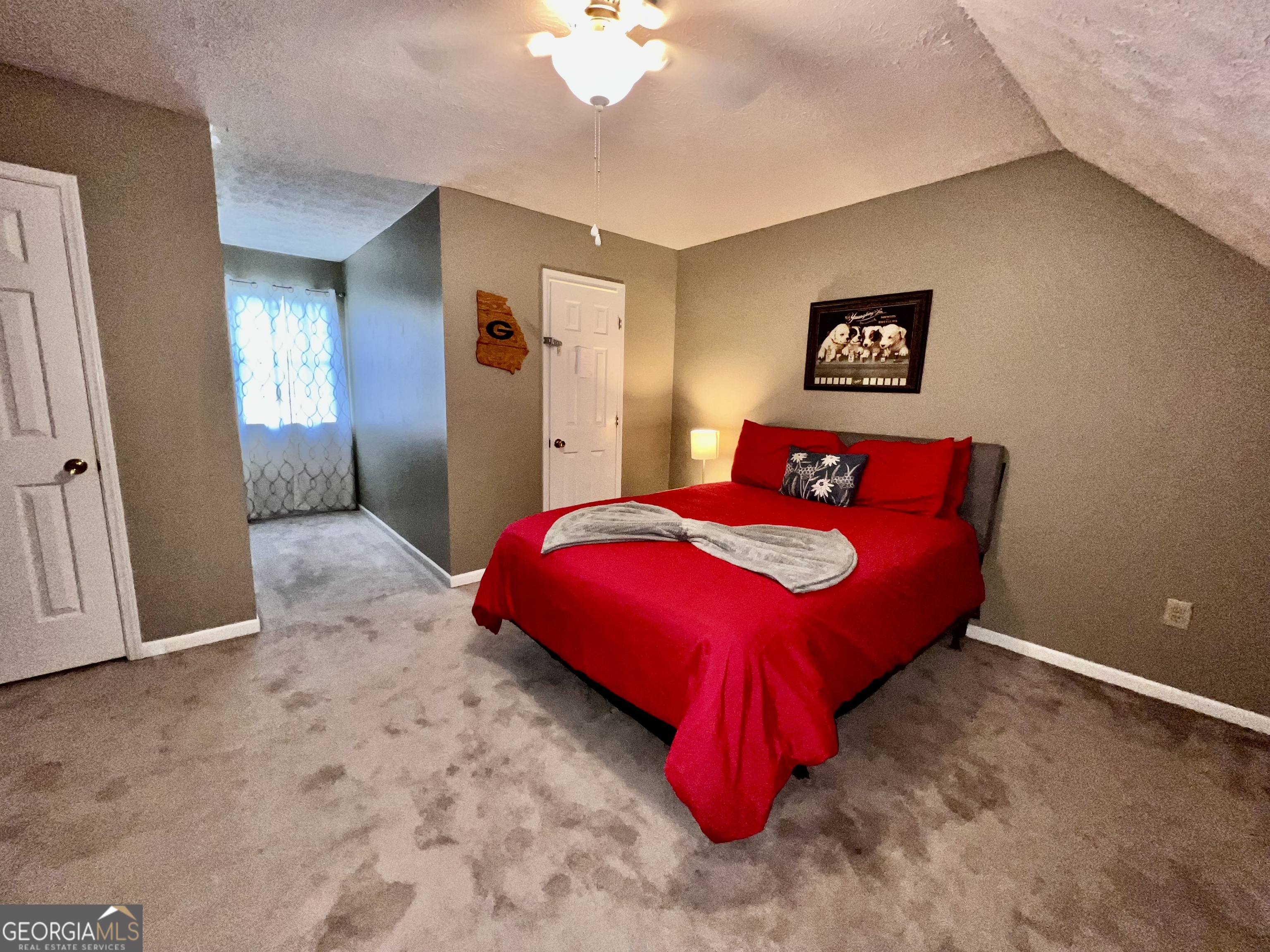 256 Cherokee Ridge Athens, GA 30606 - Photo 20 of 35 a bedroom with a bed and a chandelier