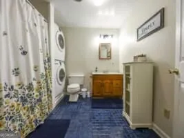 a bathroom with a sink and toilet