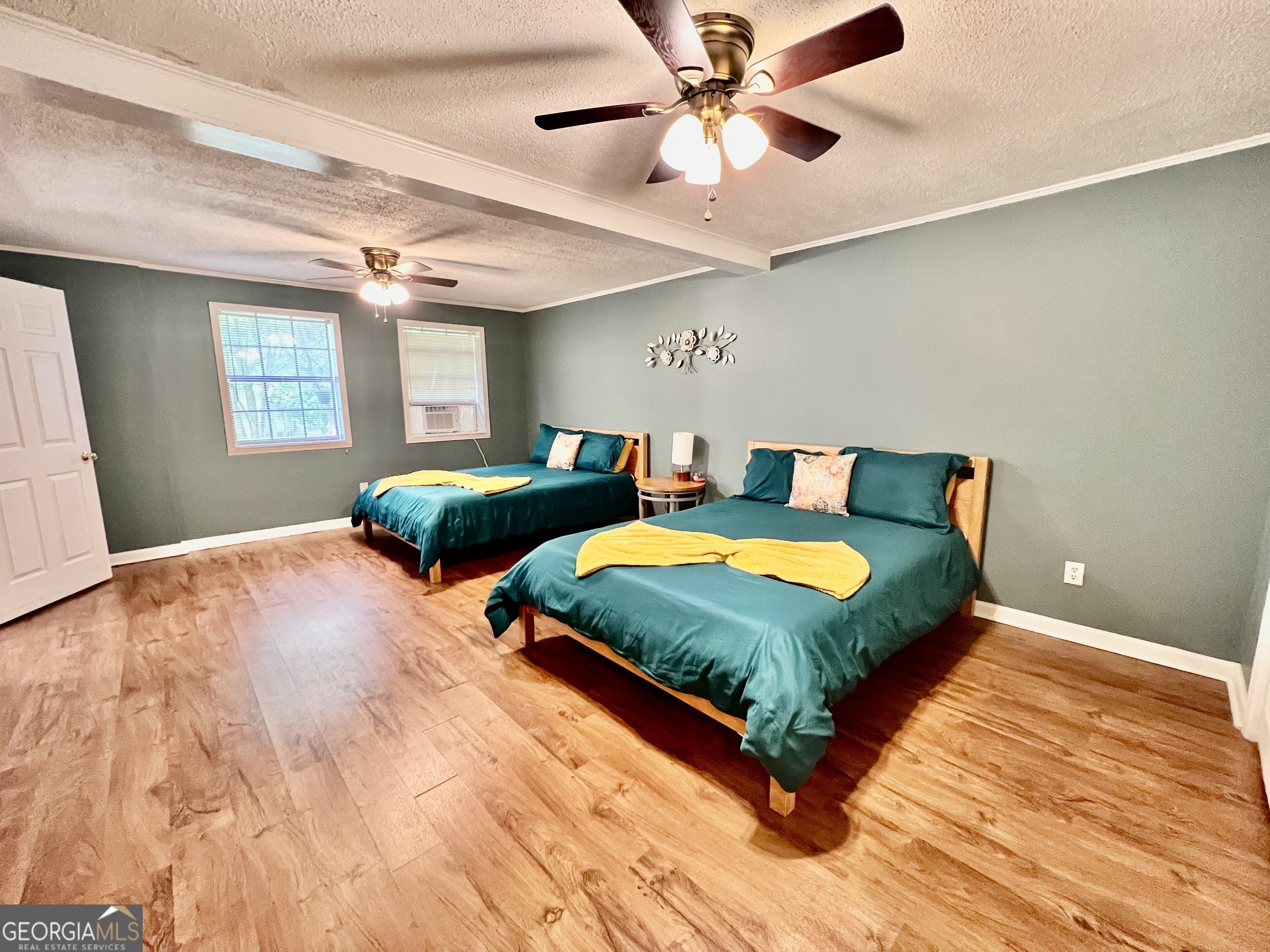 256 Cherokee Ridge Athens, GA 30606 - Photo 23 of 35 a bedroom with double bed and a chandelier