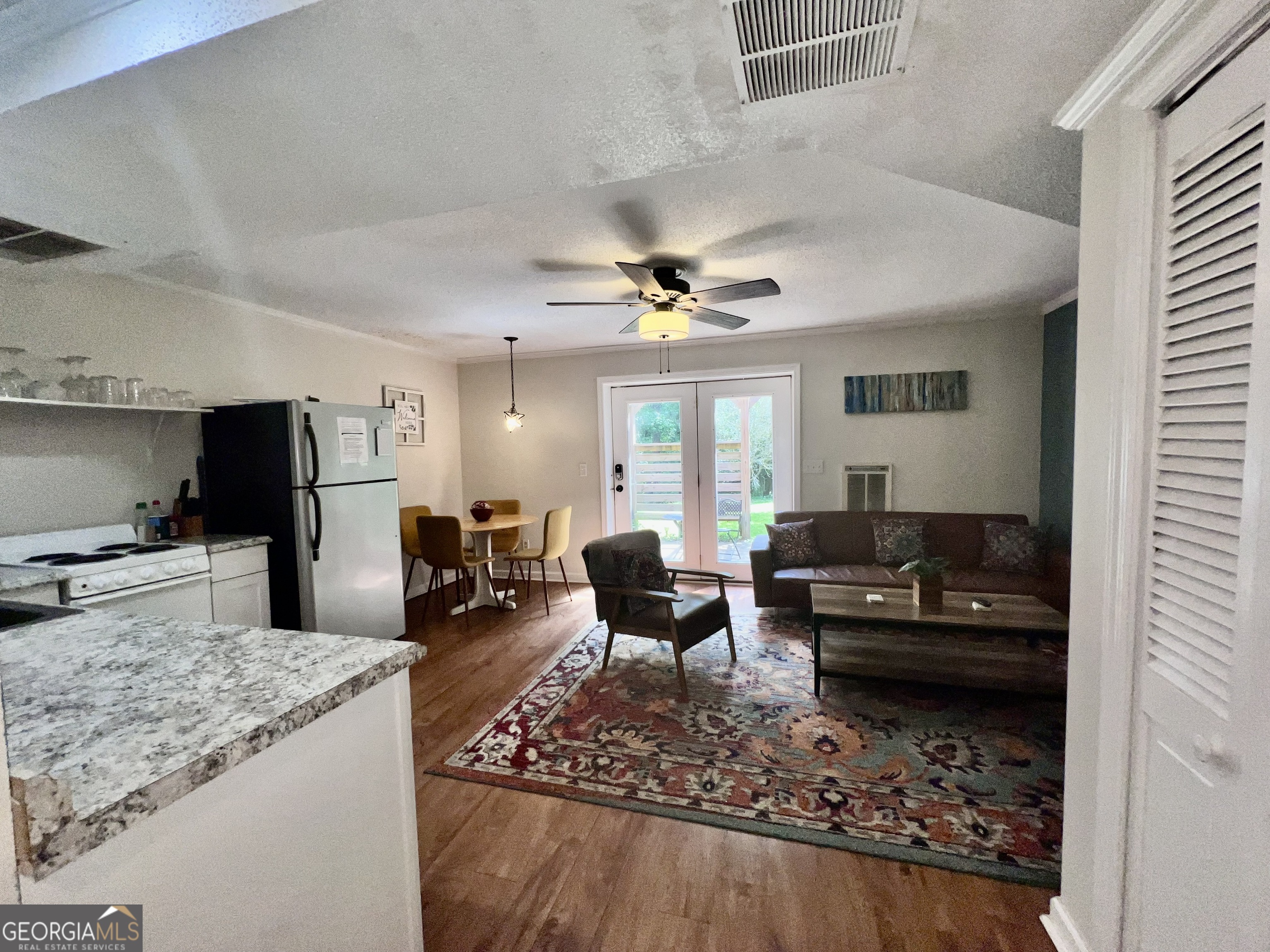256 Cherokee Ridge Athens, GA 30606 - Photo 25 of 35 a living room with furniture and a flat screen tv