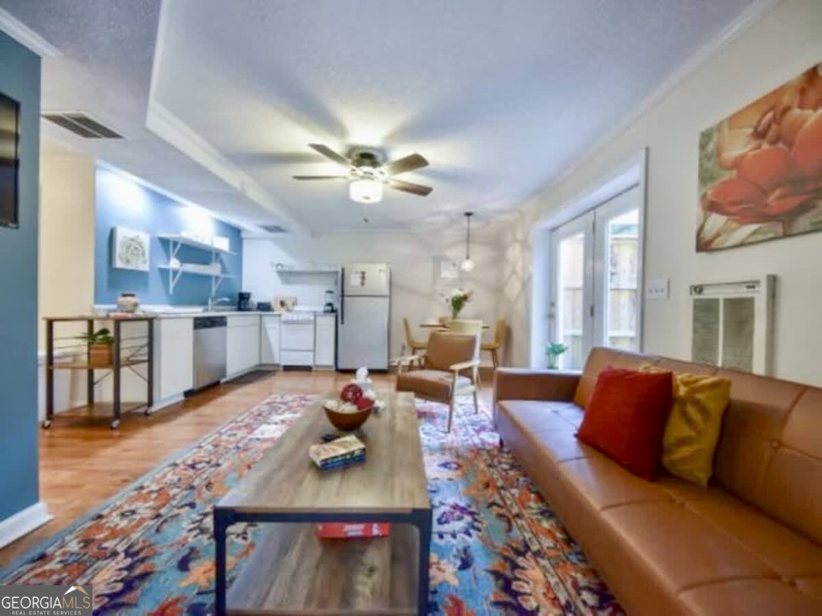 256 Cherokee Ridge Athens, GA 30606 - Photo 28 of 35 a living room with furniture kitchen view and a large window