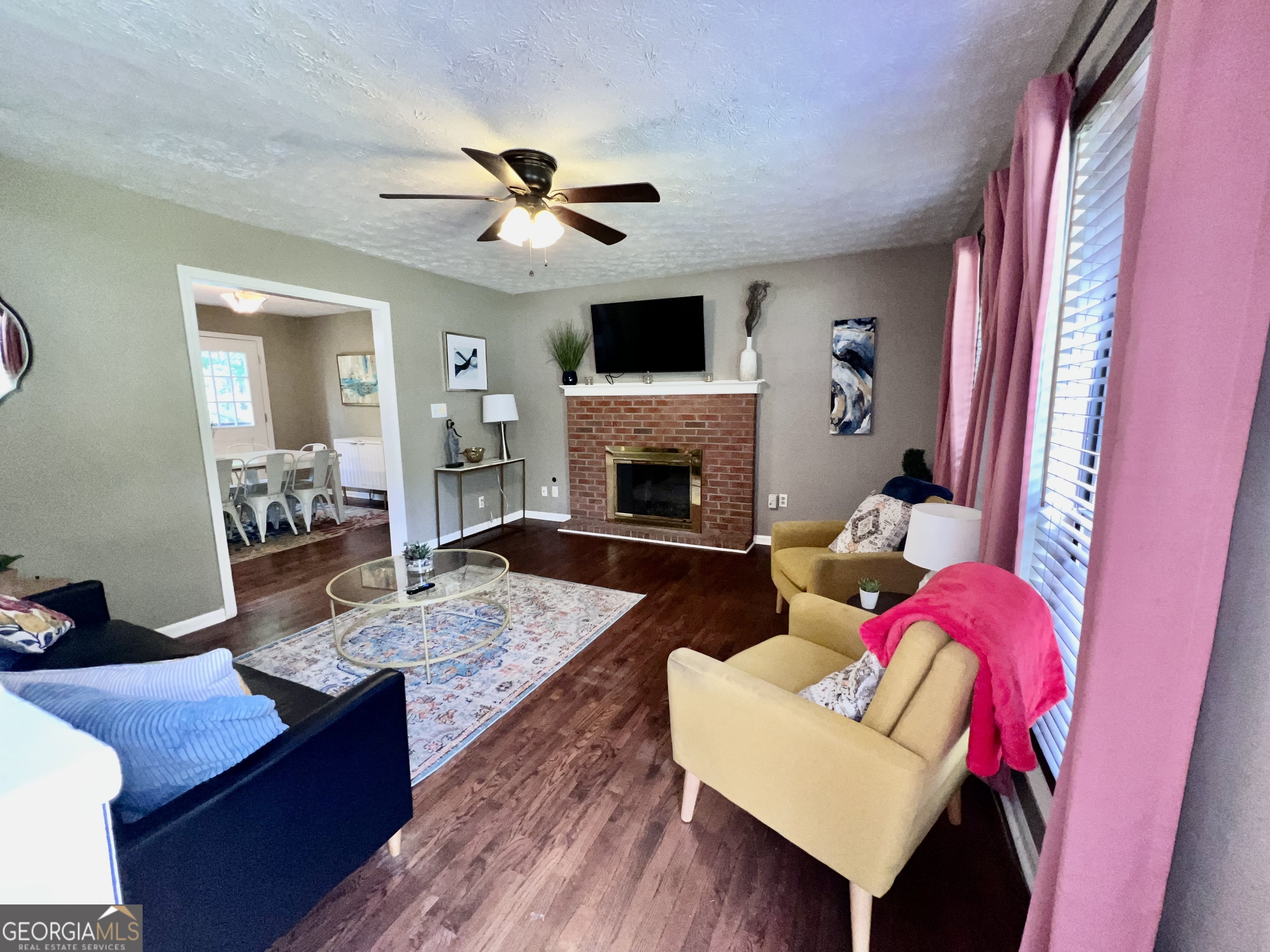 256 Cherokee Ridge Athens, GA 30606 - Photo 3 of 35 a living room with furniture fireplace and flat screen tv