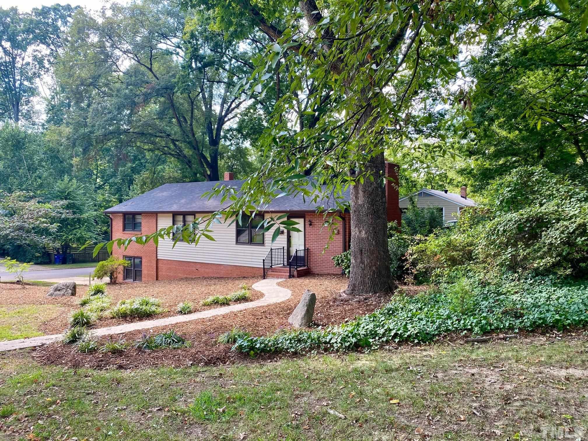 2101 Watkins Street Raleigh, NC 27604 - Photo 1 of 15 a front view of a house with garden