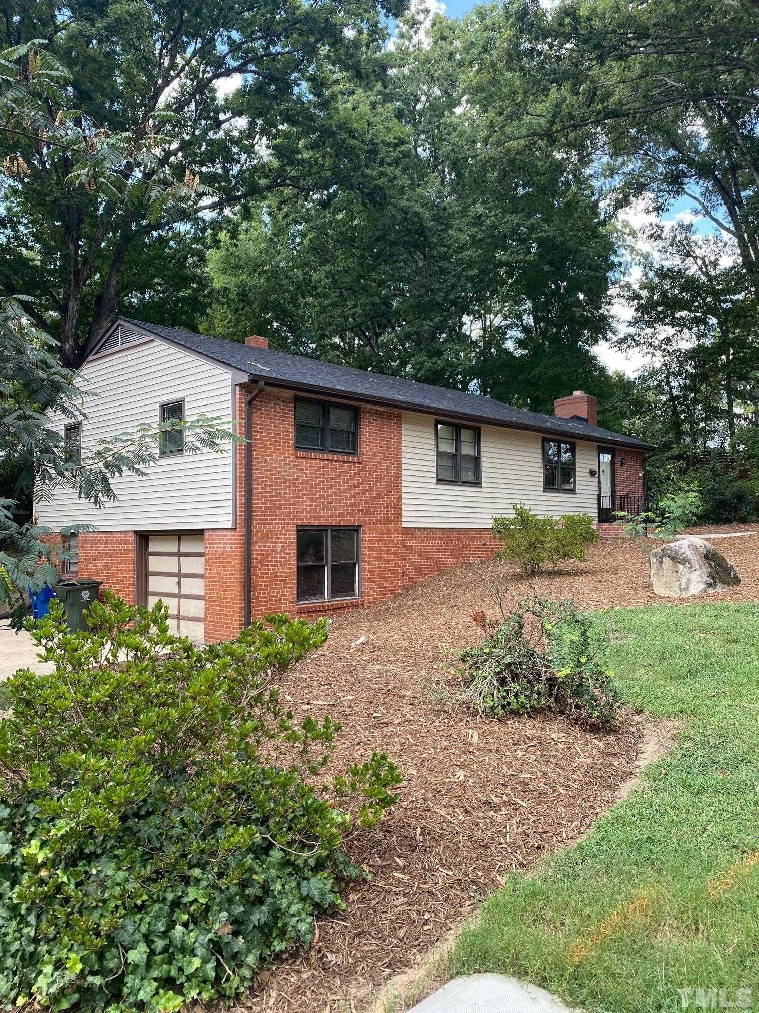 2101 Watkins Street Raleigh, NC 27604 - Photo 2 of 15 a front view of house with yard and trees