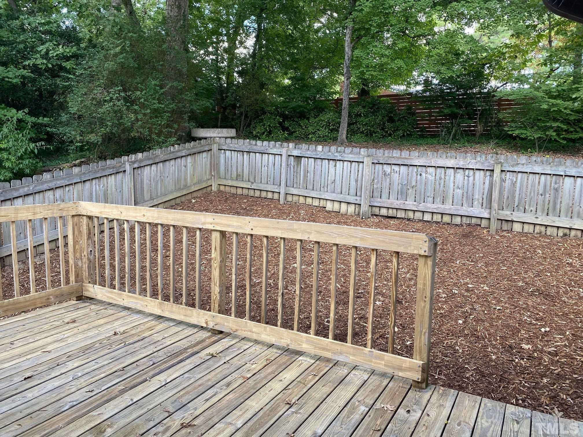 2101 Watkins Street Raleigh, NC 27604 - Photo 14 of 15 a terrace view with wooden floor and fence