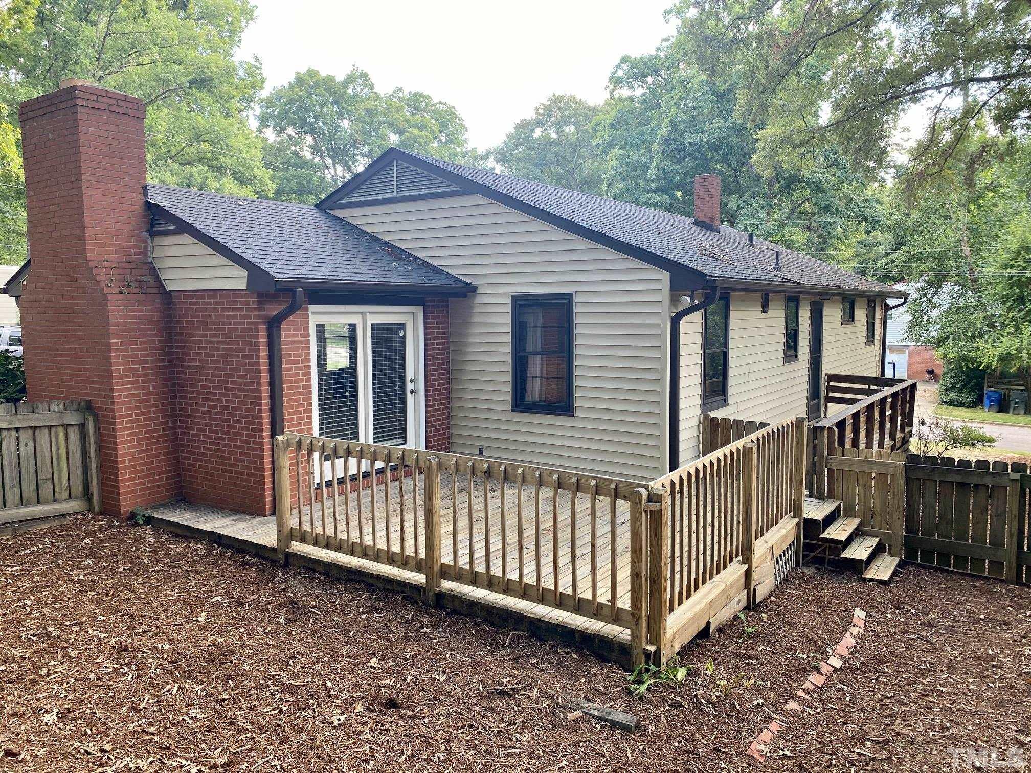 2101 Watkins Street Raleigh, NC 27604 - Photo 15 of 15 a view of a house with a yard and deck area
