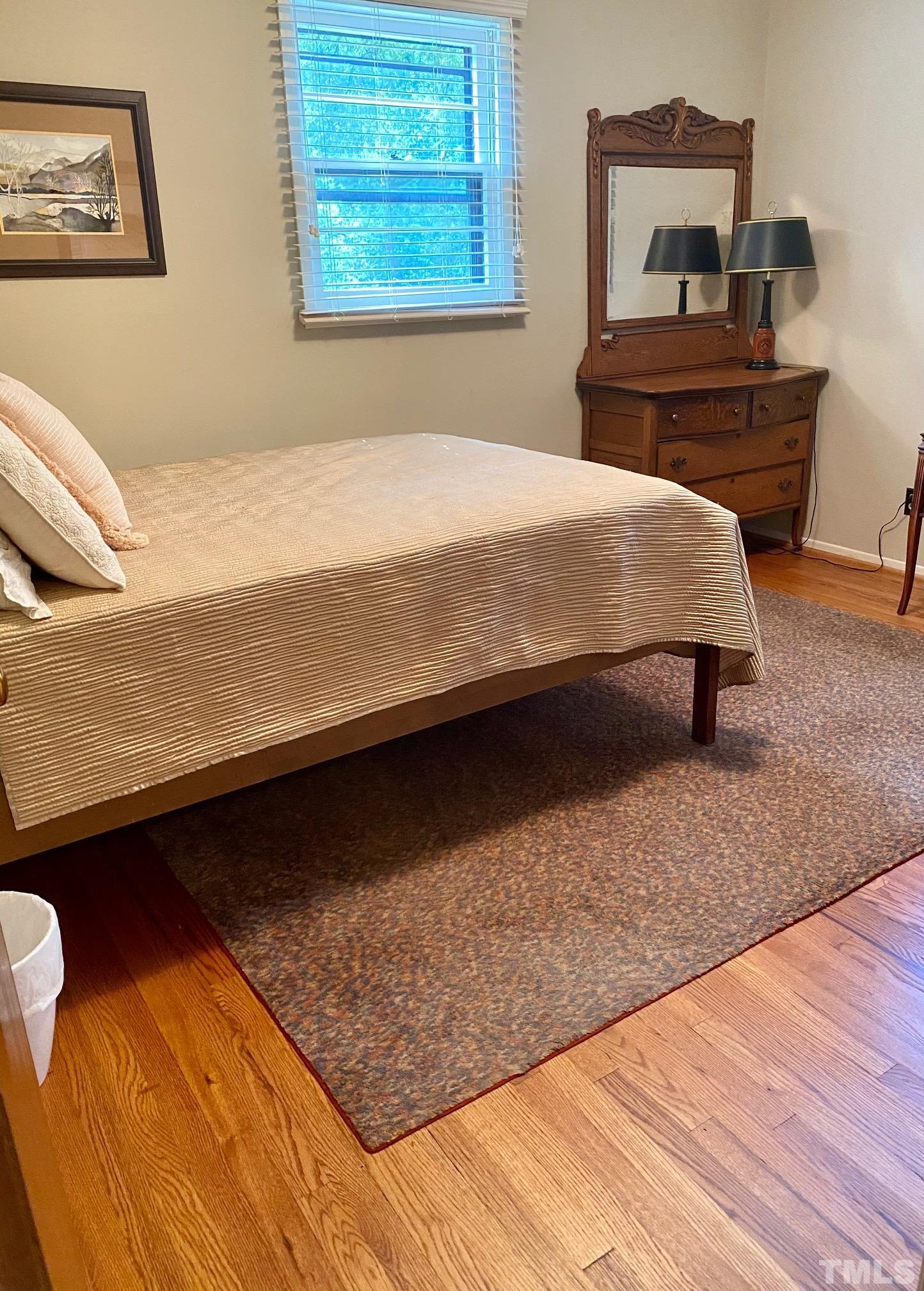 2101 Watkins Street Raleigh, NC 27604 - Photo 7 of 15 a bedroom with a bed and a desk