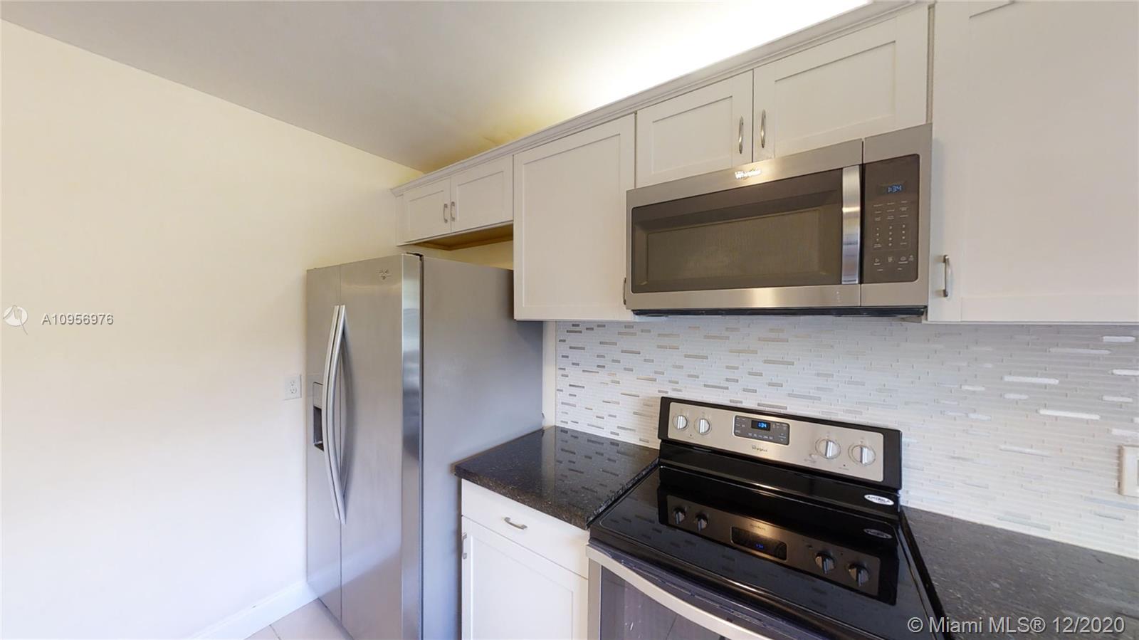 8915 Old Pine Road Boca Raton, FL 33433 - Photo 19 of 48 Kitchen with Granite Countertops and Stainless steel appliances