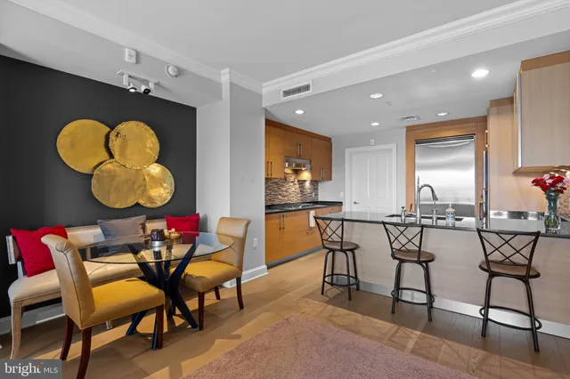 a view of a dining room with furniture and chandelier