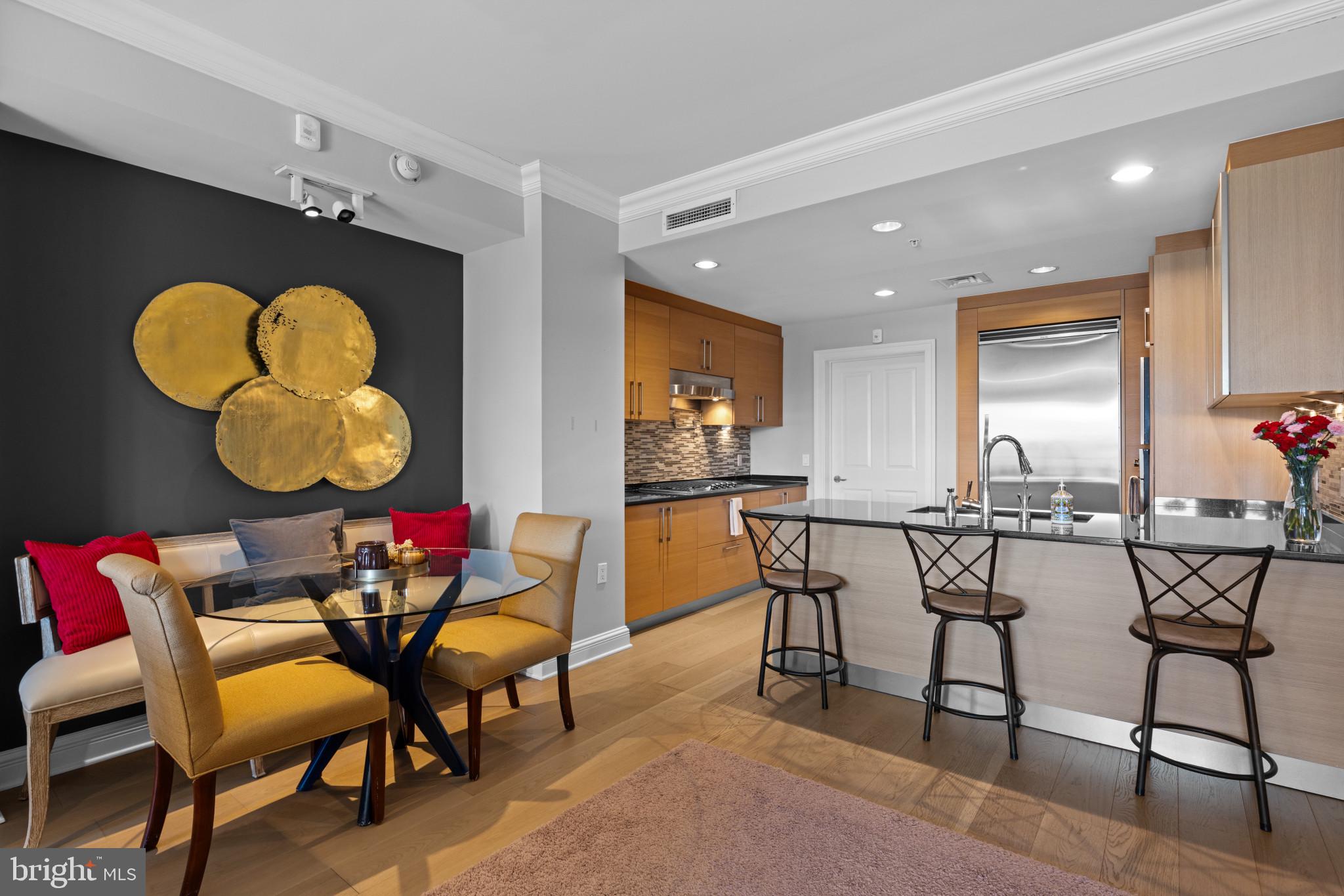 801 Key Highway, Unit T70 Baltimore, MD 21230 - Photo 15 of 43 a view of a dining room with furniture and chandelier