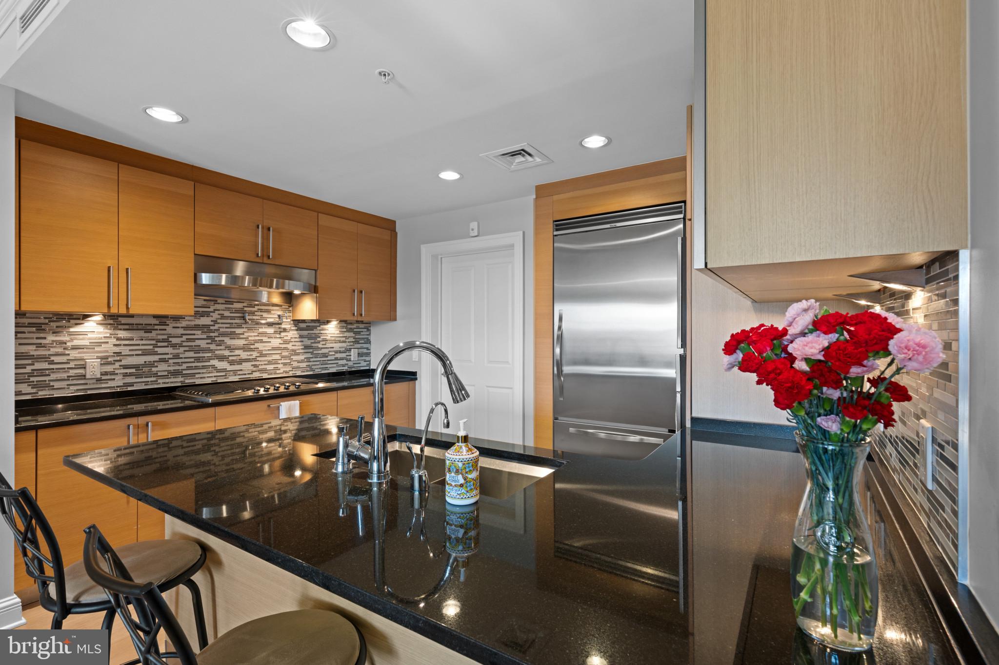 801 Key Highway, Unit T70 Baltimore, MD 21230 - Photo 18 of 43 a kitchen with a table and chairs in it