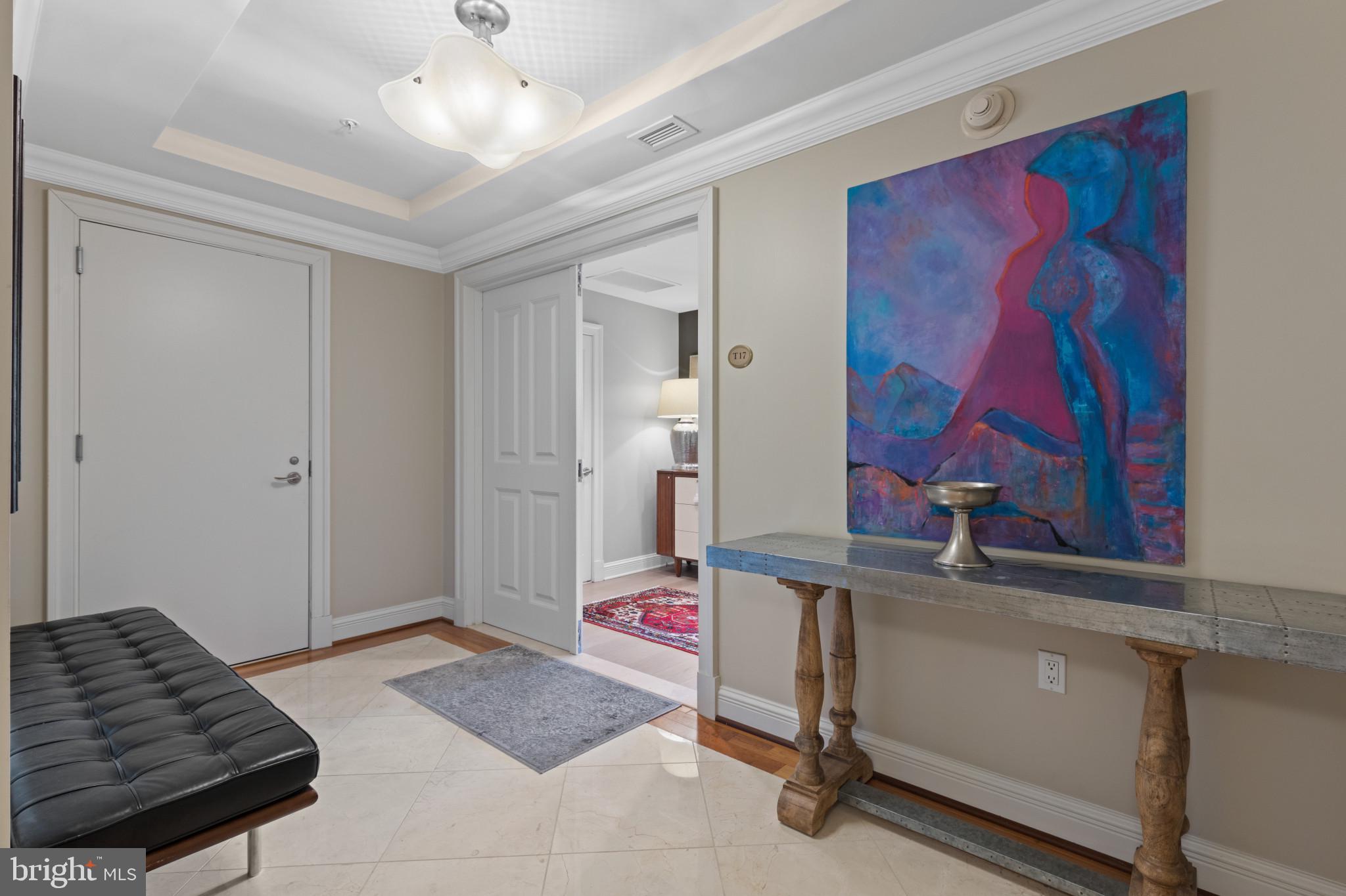 801 Key Highway, Unit T70 Baltimore, MD 21230 - Photo 2 of 43 a bedroom with a bed and a couch