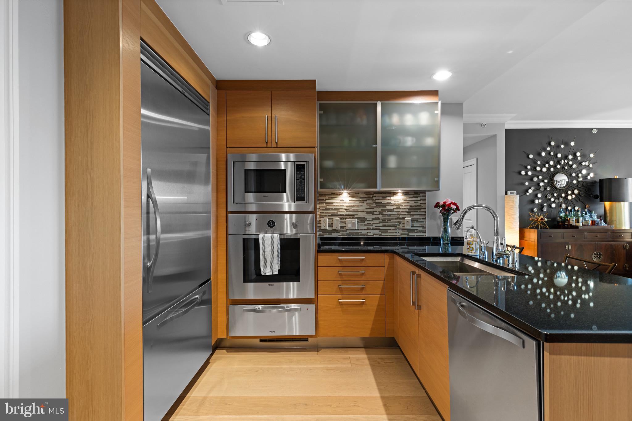 801 Key Highway, Unit T70 Baltimore, MD 21230 - Photo 21 of 43 a kitchen with stainless steel appliances granite countertop a refrigerator and a stove