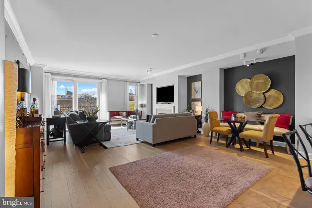 a living room filled with furniture and a flat screen tv