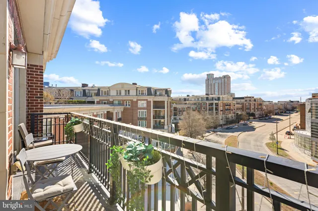 a view of a balcony with furniture