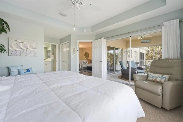 a spacious bedroom with a bed and a couch