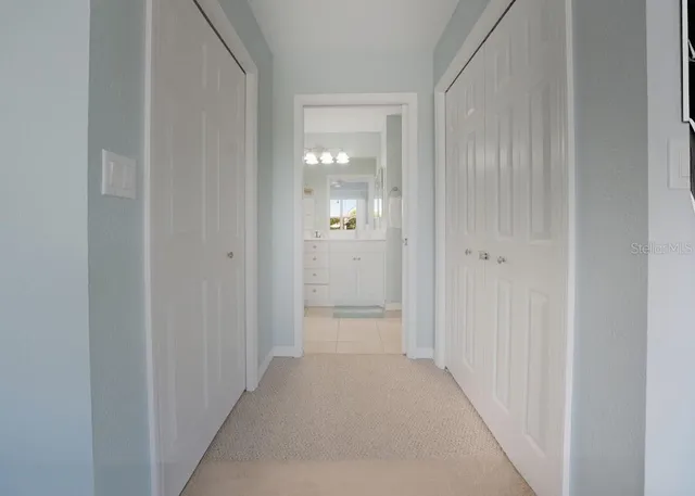 a bathroom with a double vanity sink mirror and shower