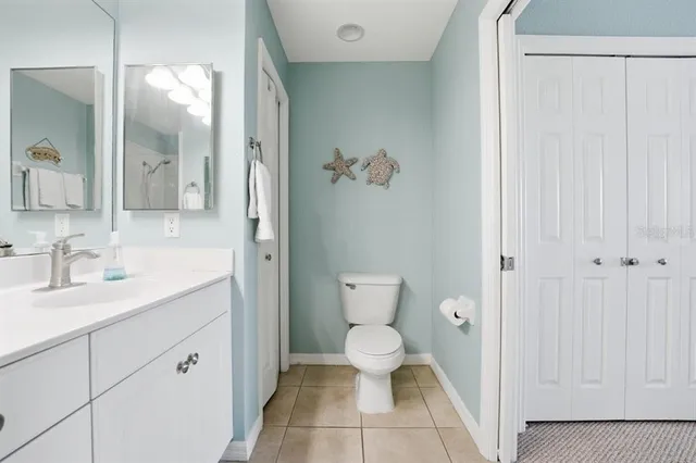 a kitchen with a stove a sink and a microwave