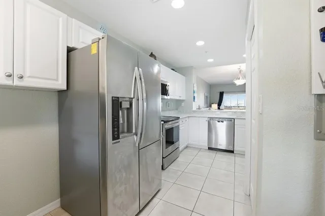 a room with furniture a flat screen tv and a window