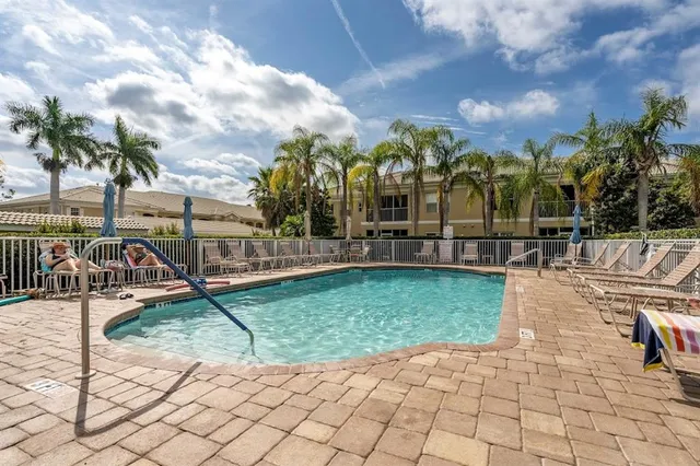 a view of a swimming pool with a patio