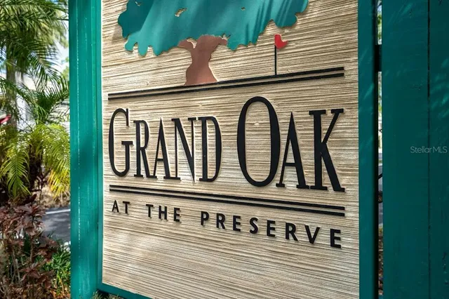 an aerial view of a house with garden space and street view