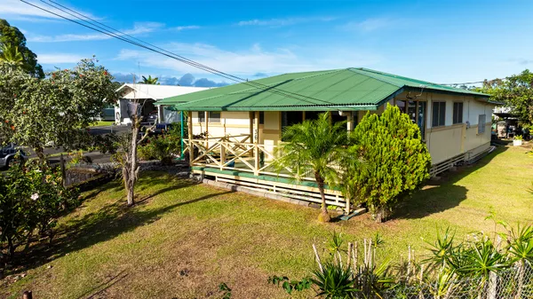 a view of a house with swimming pool in front of it