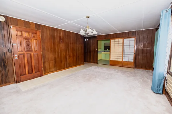 a view of an empty room with a window