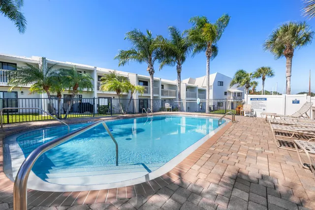 a view of a swimming pool with a patio