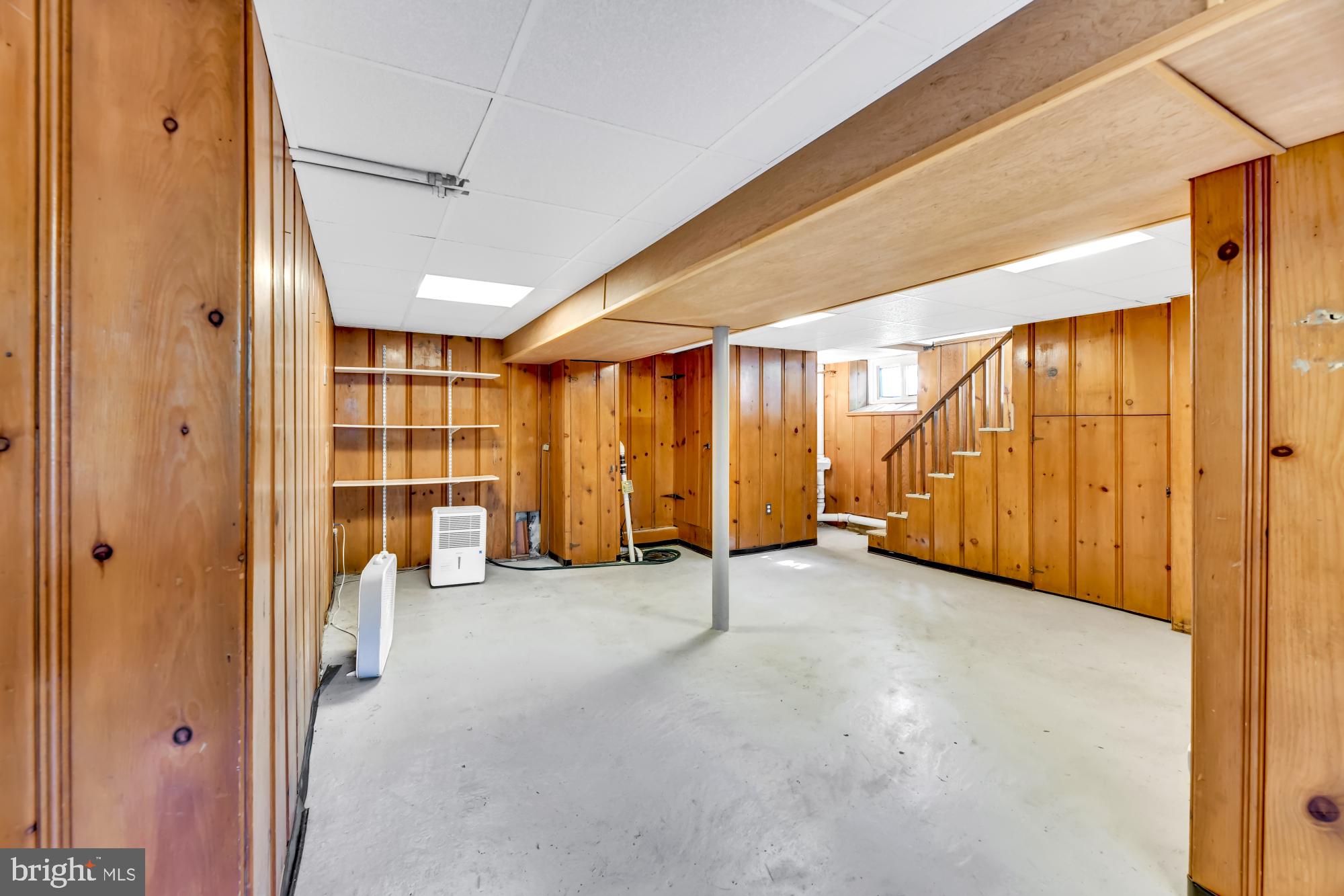 420 Westgate Road Baltimore, MD 21229 - Photo 22 of 30 Spacious basement with warm-toned wood panelling