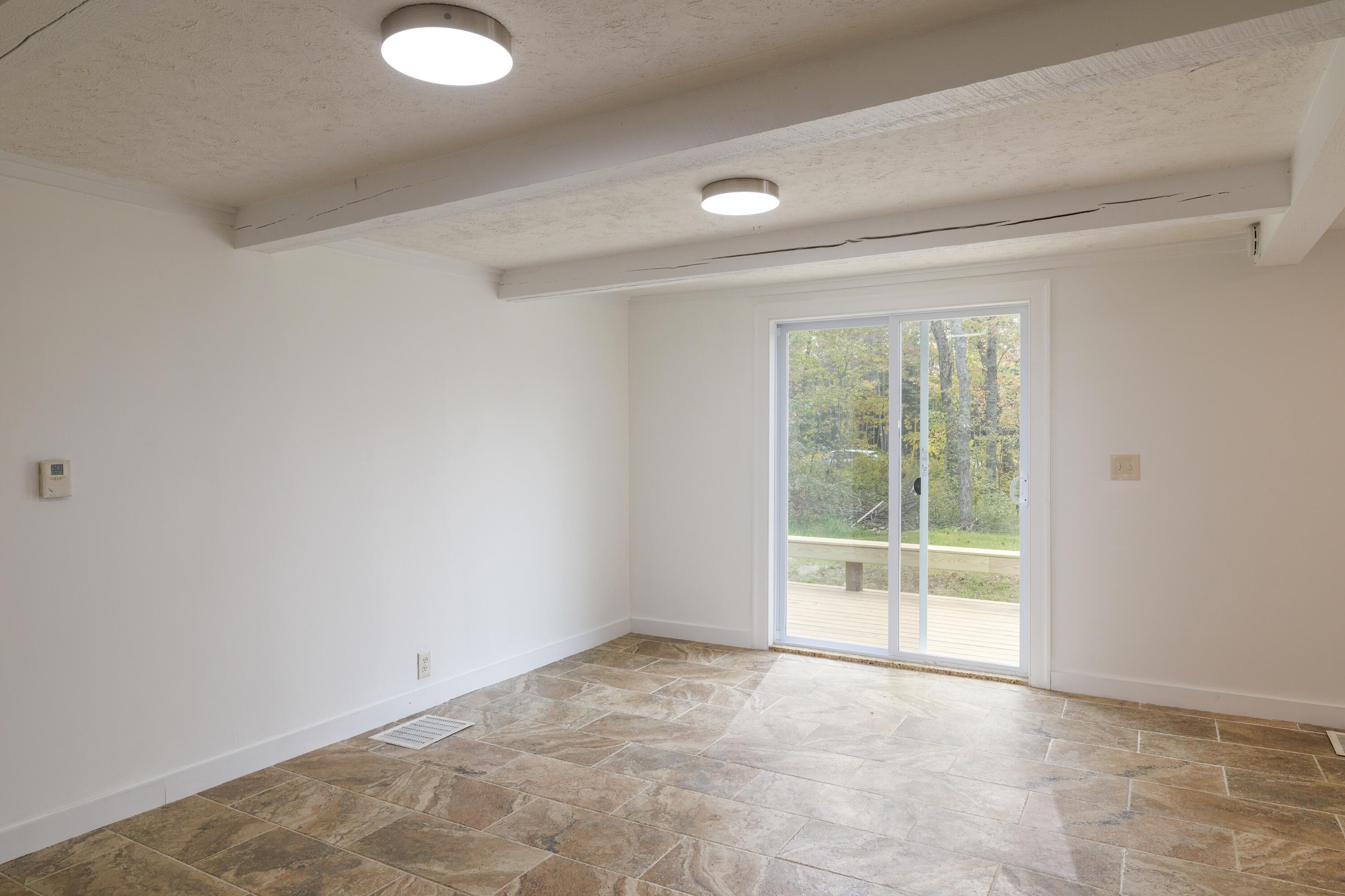 308 Blue Hill Road Surry, ME 04684 - Photo 35 of 43 Living Room toward Deck Entry