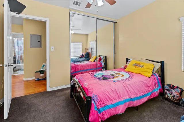 a bedroom with two beds and painted walls