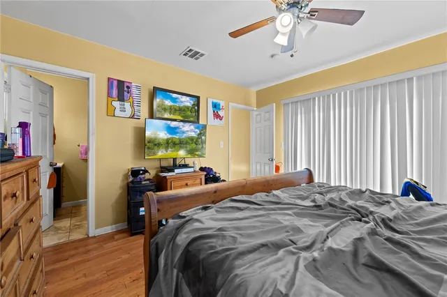 a bed room with a bed and a window