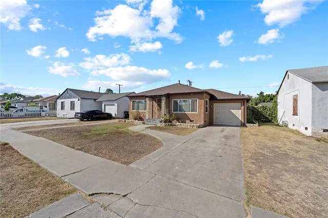 a front view of a house with yard