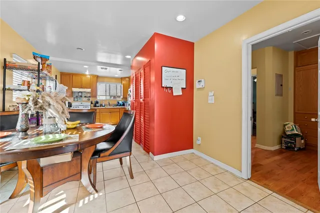 a view of a dining room with furniture and a chandelier