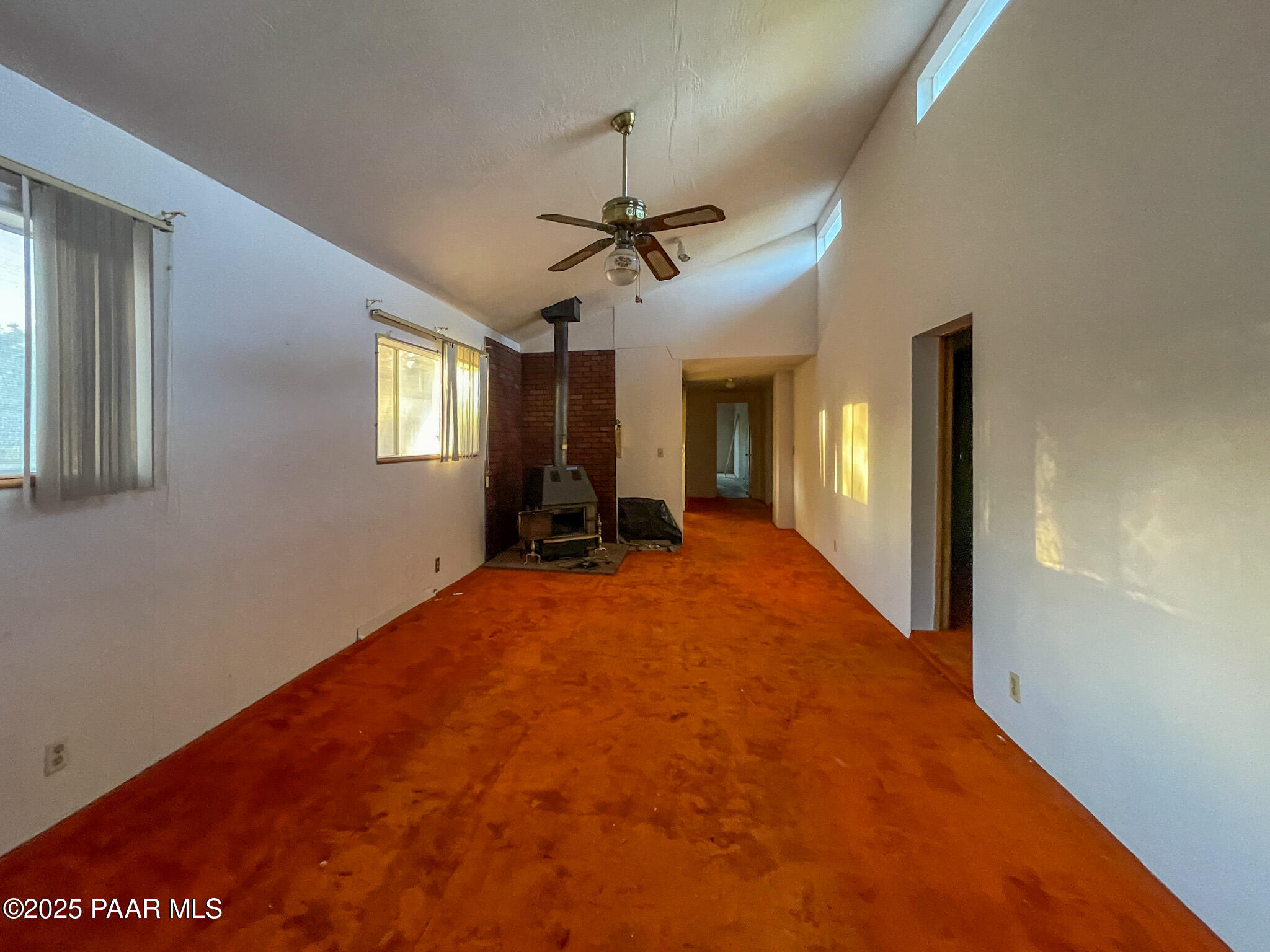 10198 Miami Street Mayer, AZ 86333 - Photo 11 of 29 a view of a livingroom with a chandelier fan and windows