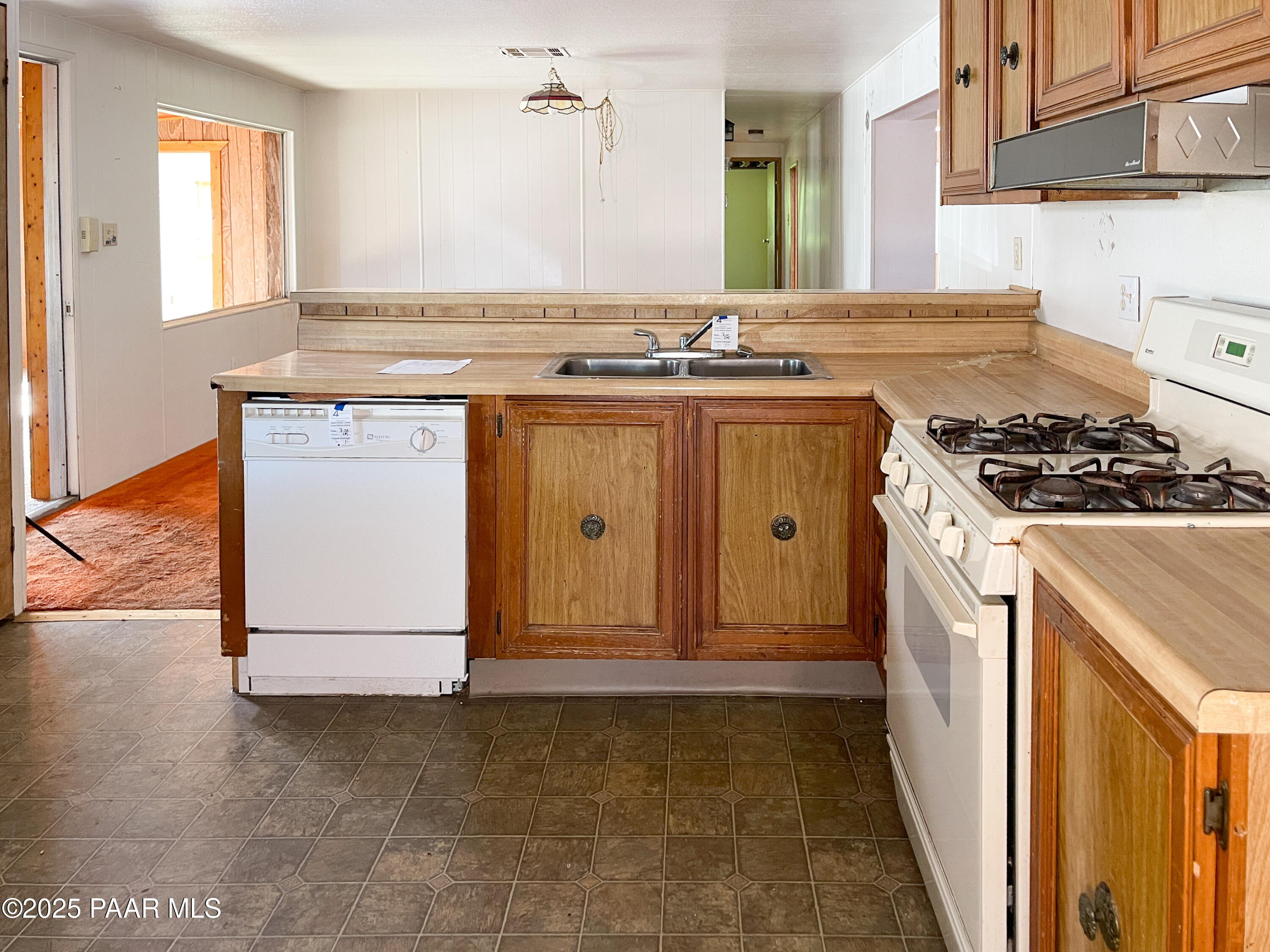 10198 Miami Street Mayer, AZ 86333 - Photo 6 of 29 a kitchen with a stove and a sink