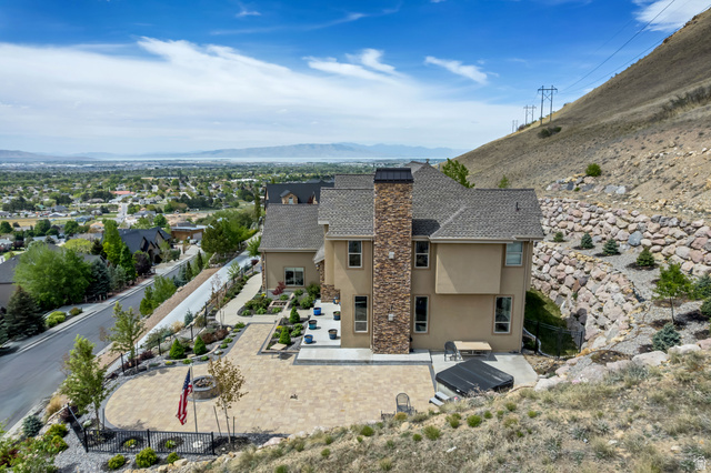 2543 East 700 South Springville, UT 84663 - Photo 68 of 73 Rear view of property with stucco siding, a mountain view, a patio area, and a fenced backyard