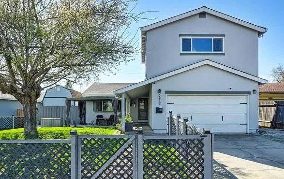 front view of a house with a yard