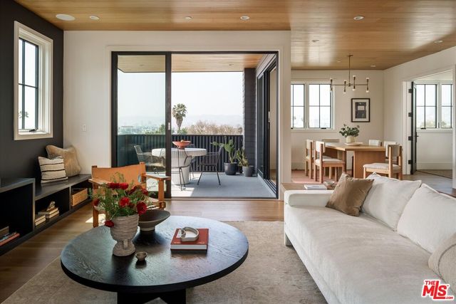 a living room with furniture and a table